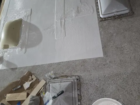 Here you're seeing as we just finished up putting a CO commercial grade acrylic silicone coding down over the area that we cut and rolled back