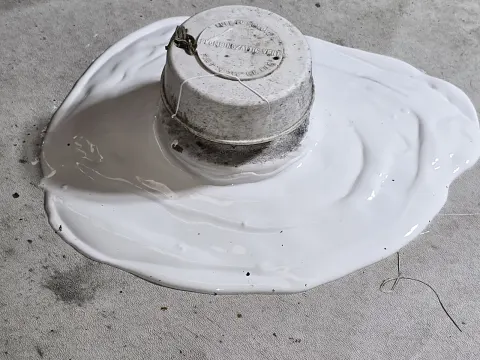 This plumbing stack's officially been covered with glorified liquid flash really You may think it's lap sealant but it is not unlike lap sealant this will not crack peel blister or anything guaranteed for 10 years